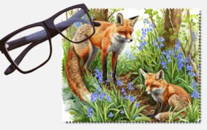A fox and a baby fox in a forest printed lens cleaning cloth