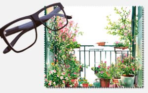 A balcony with pot with different coloured flowers printed lens cleaning cloth